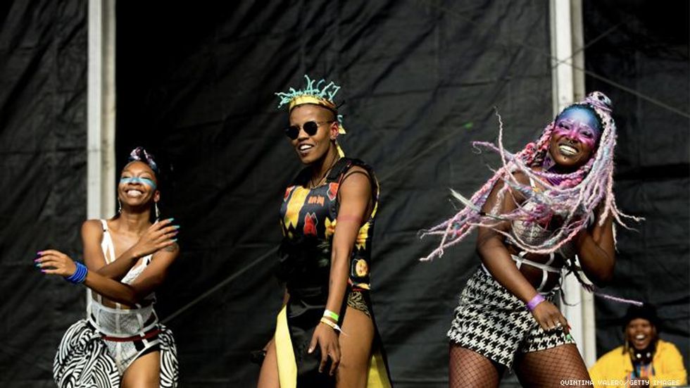 3 Black women on stage: Toya Delazy performing at the UK Black Pride in London, UK 2019