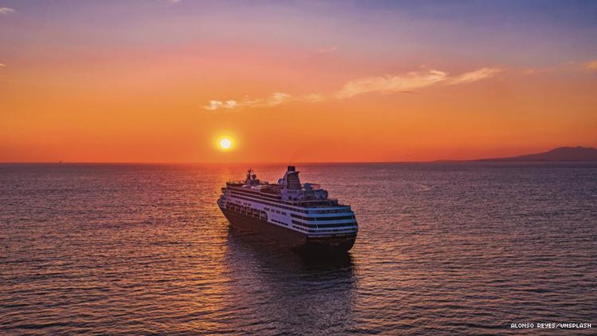 A cruise ship on ocean with rising sun