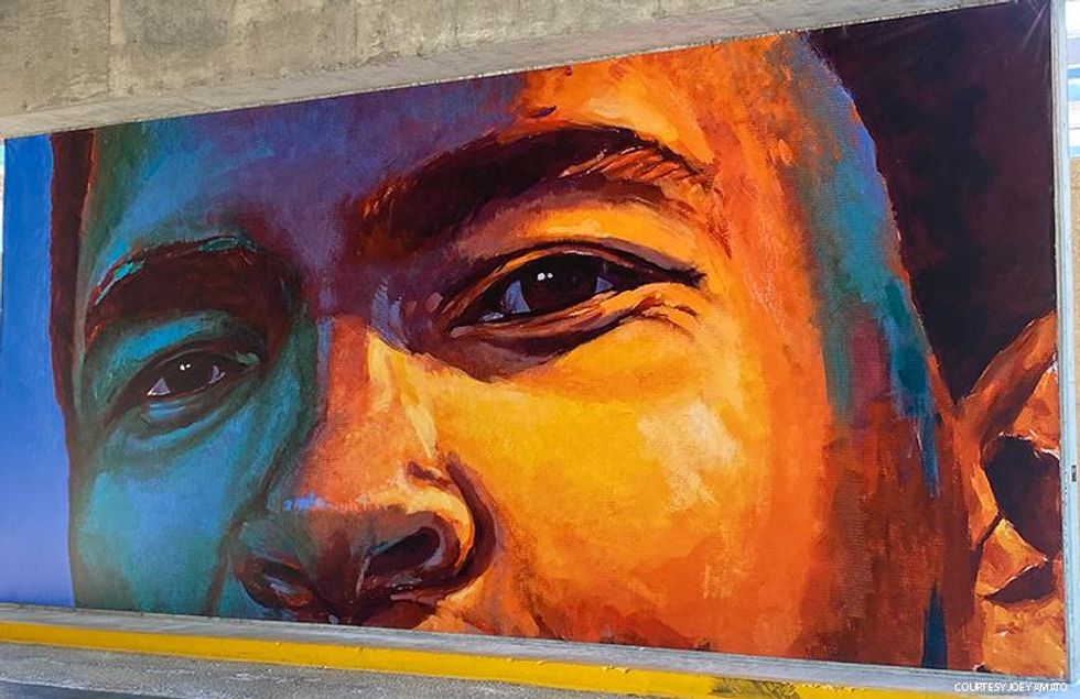 A LGBTQ+ Guide to Louisville, Kentucky - a mural honoring boxing legend Muhammad Ali