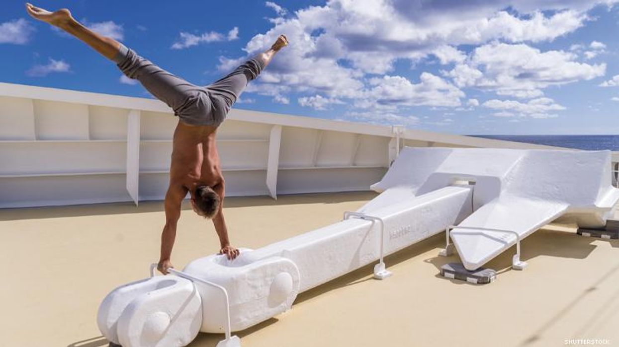 A man does upside down splits on a cruise ship