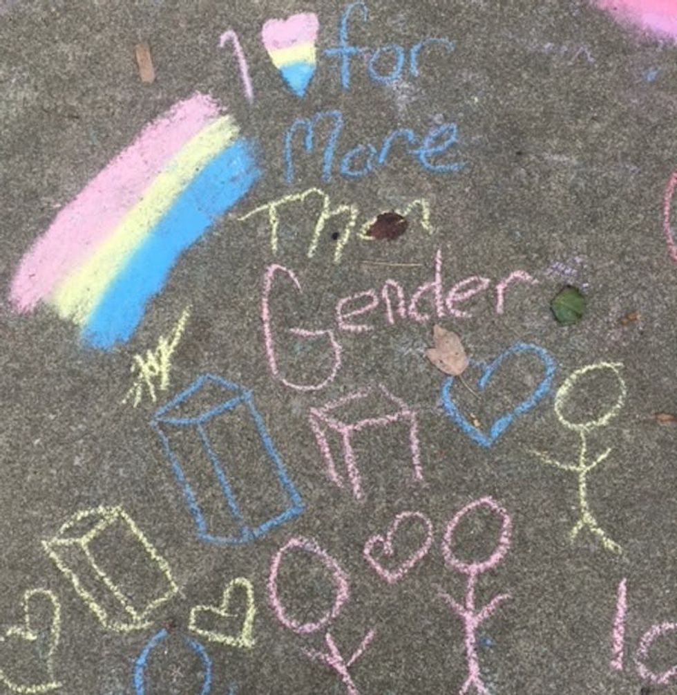 A multicolored chalk message supporting Pride on a sidewalk in Pikeville during its Pride celebration.
