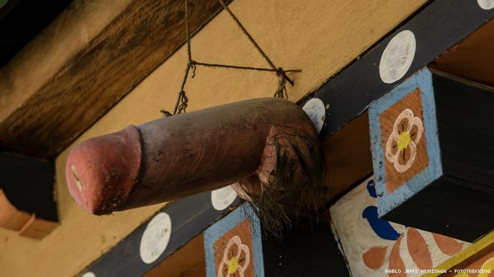 A phallic carving over a door