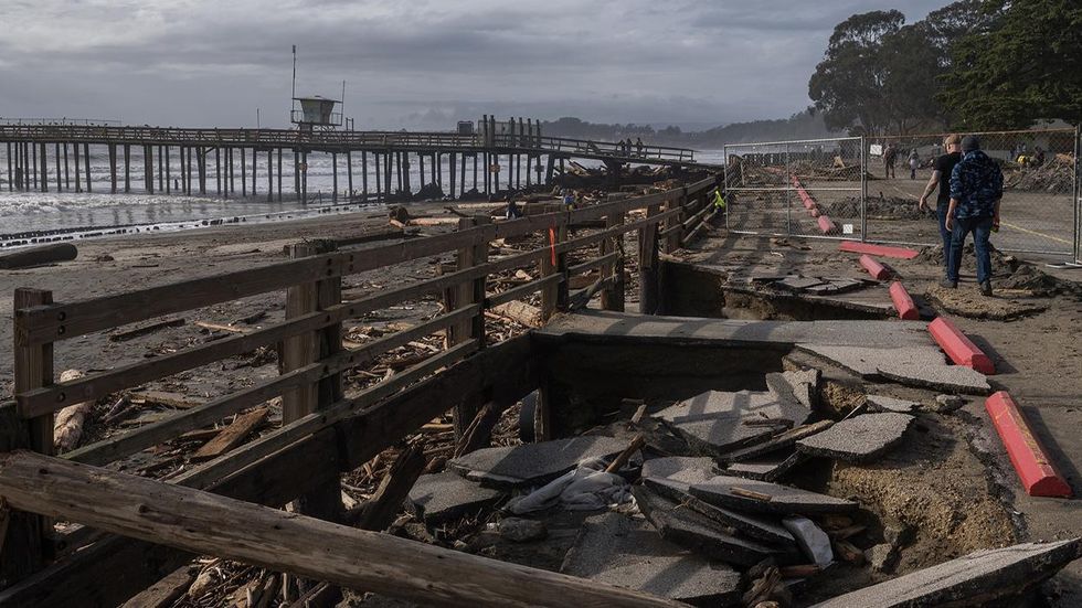 A sunken section of a parking lot after a rain storm at Seacliff State Beach in Aptos, California, 