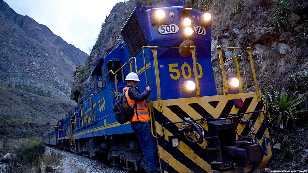 A train carries stranded Ameerican tourists from Machu Picchu to Ollantaytambo