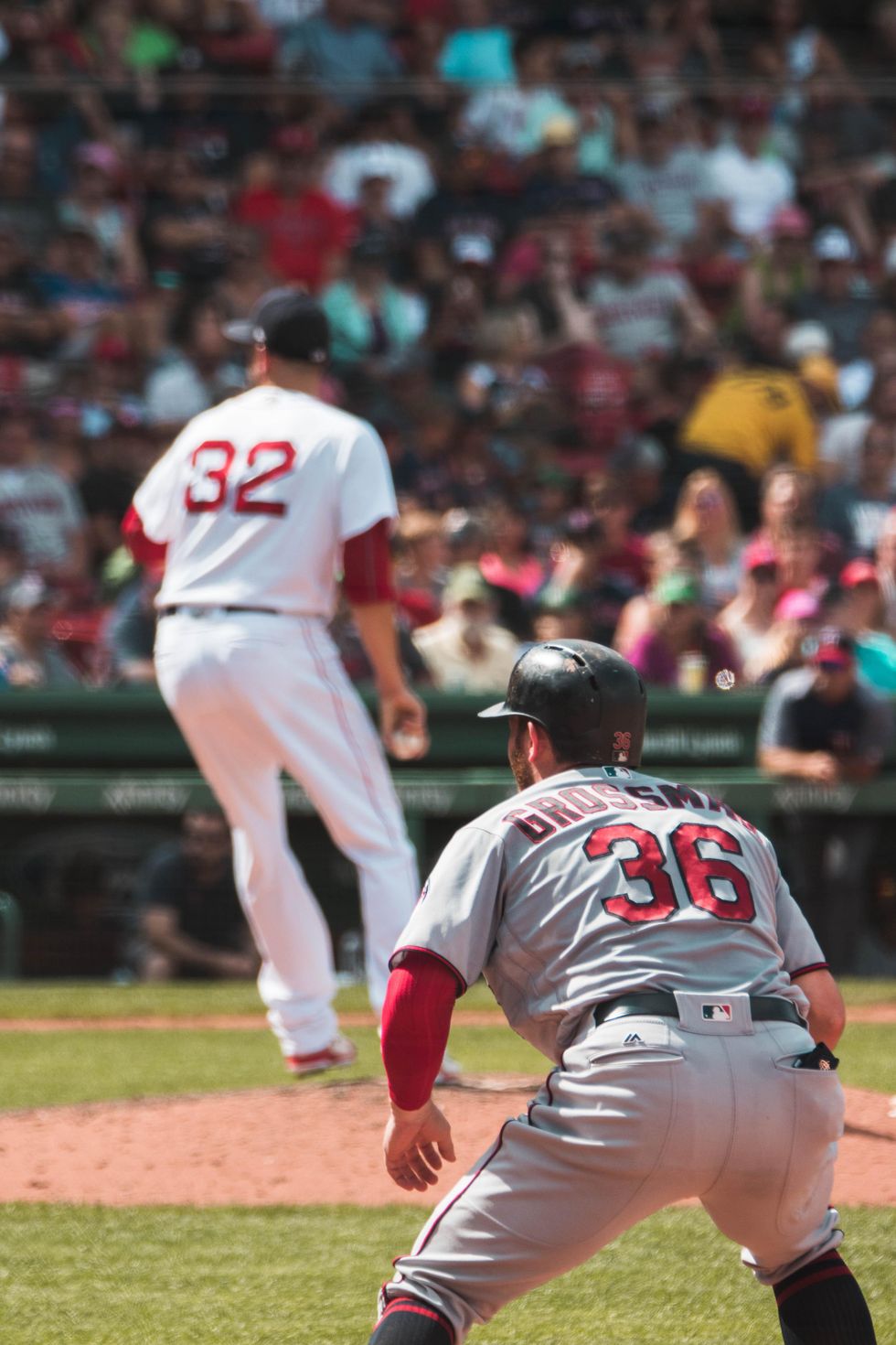 baseball players playing at Fenway Park in Boston