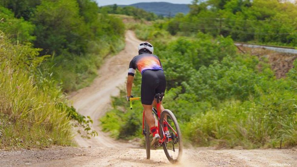 Bike rider on gravel road