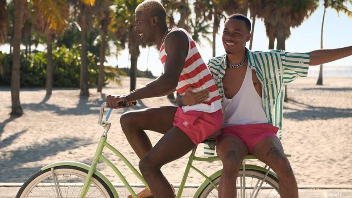 Black gay couple on bike