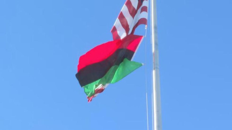 Black History Flag flies over the Denver Federal Center