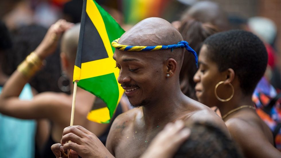 Black man flies Jamaica flag at LGBT Pride event