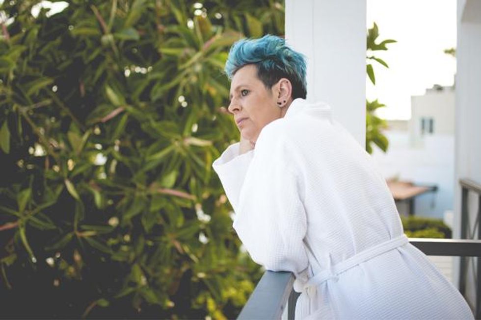 Blue haired white woman in robe