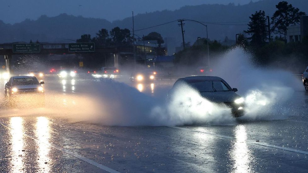 California drivers deal with torrential rain and hurricane force winds as a powerful bomb cyclone slams into the state.