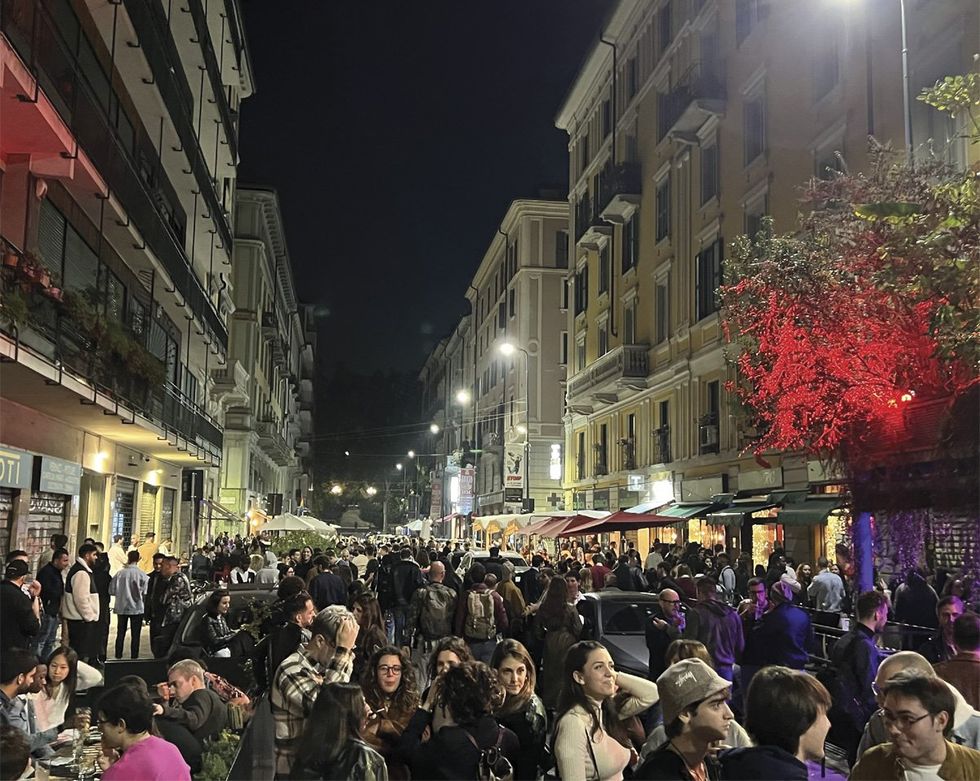 Crowds fill the street of Milan's Rainbow District of Porta Venezia