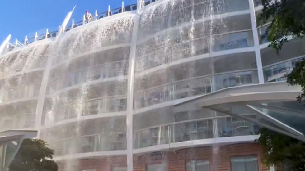 Cruise passengers were treated to a six-story waterfall at sea after their ship made a hard turn to avoid a raft