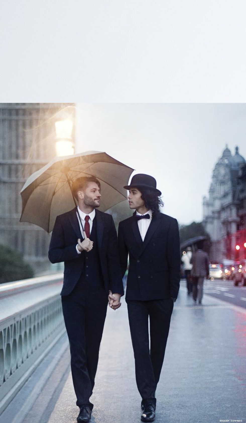 Dapper gay couple walk through London rain by Braden Summers