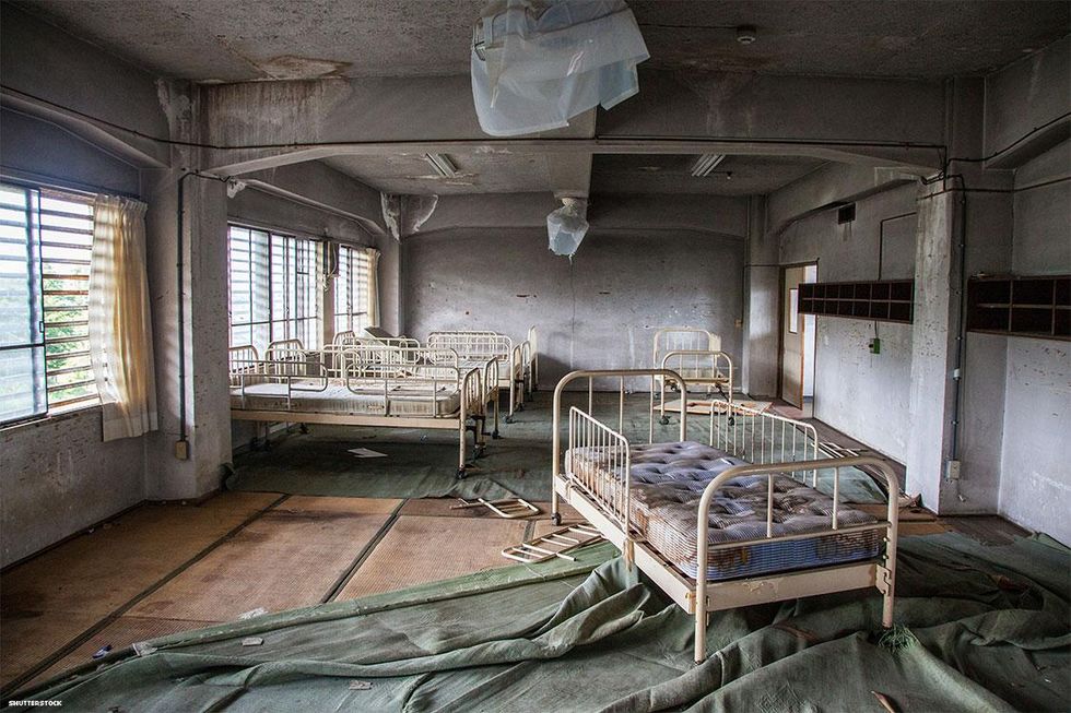 Empty Ward at Abandoned Hospital with beds left behind