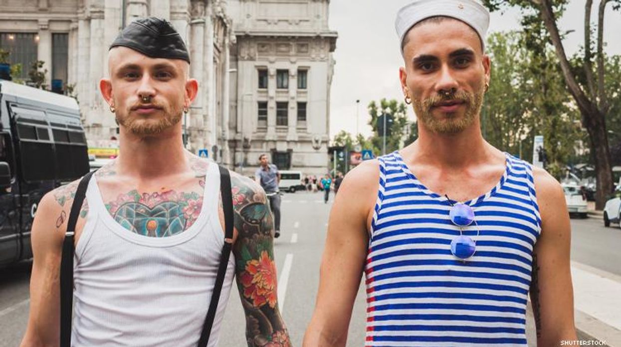 gay couple holding hands in milan Itally