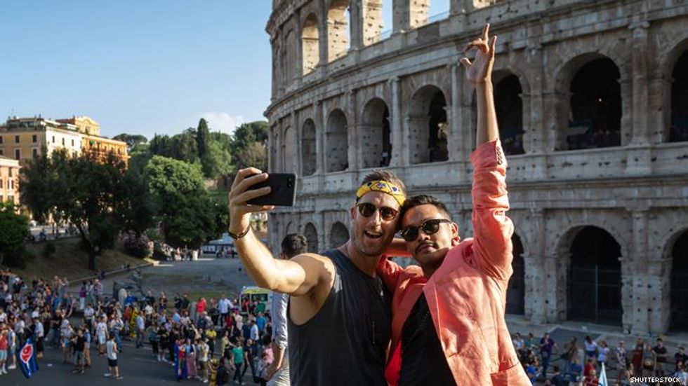 Gay couple in front of Coliseum Rome