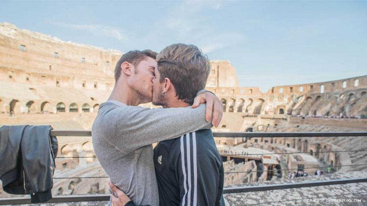 Gay Couple kissing at the Colosseum in Rome