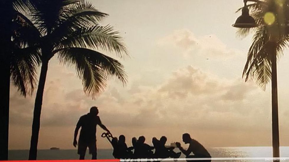 Greater Together ad image featuring two dads with triplets on a Ft Lauderdale beach