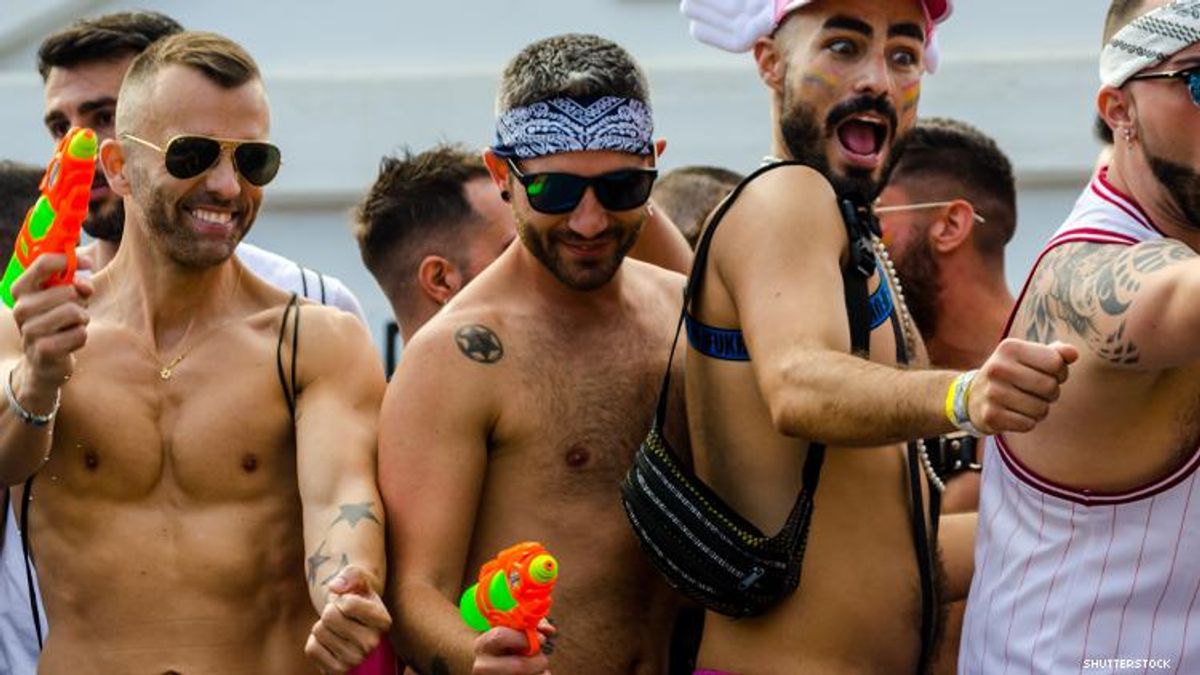 Group of gay men in swim trunks having fun