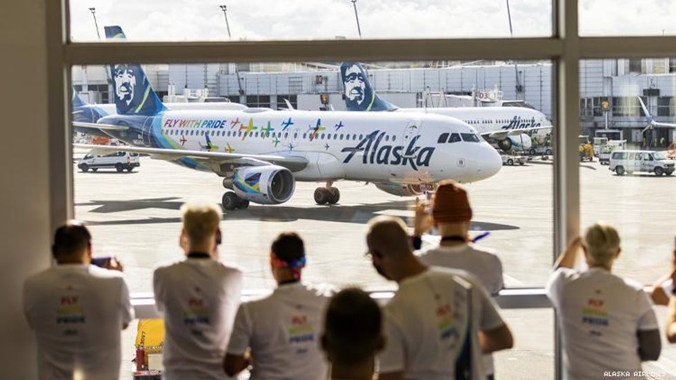 Guests line up to see the Alaska pride plane