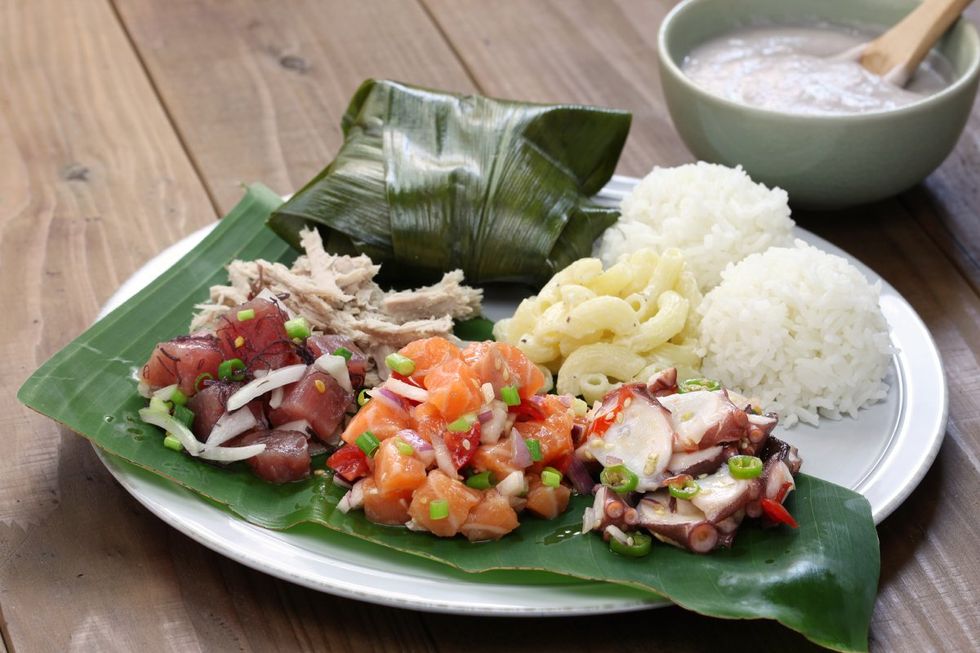 hawaiian traditional plate ahi poke, lomi lomi salmon,  tako poke, kalua pork poi, and lau lau