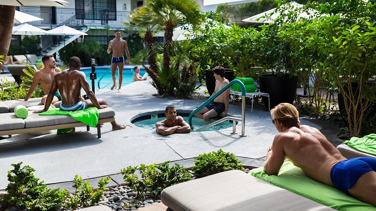 Hunky gay men lounge poolside and in the jacuzzi at the Descanso Resort, a gay men's clothing optional resort 
