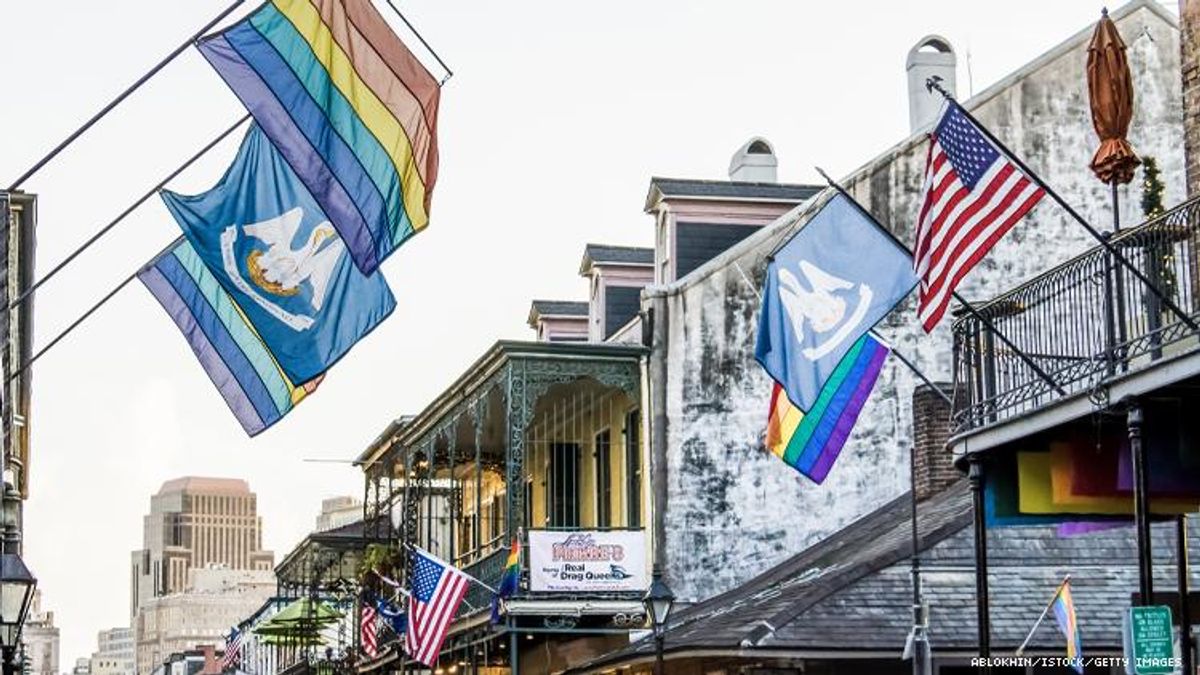 Image of rainbow flag flying over French Quarter in New Orleans