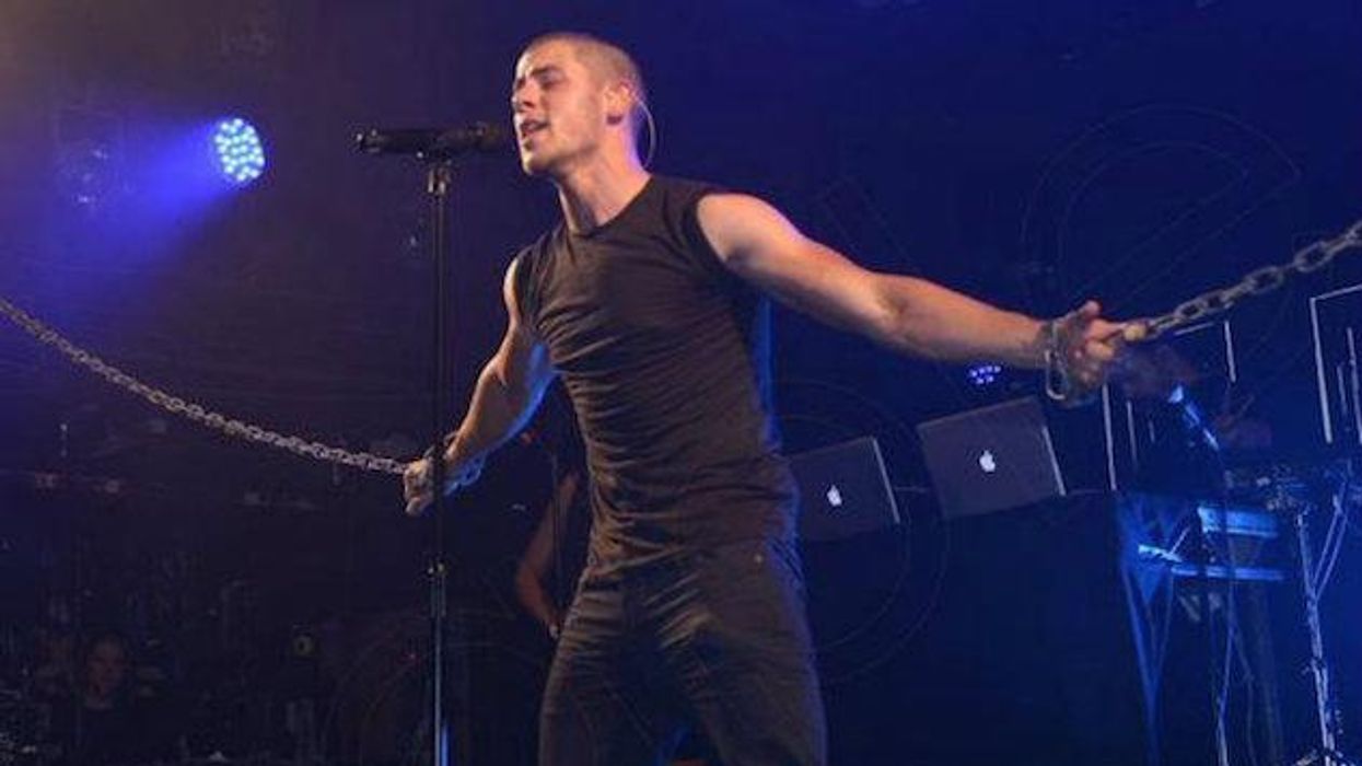 WATCH: Nick Jonas Chained Up at London's G-A-Y