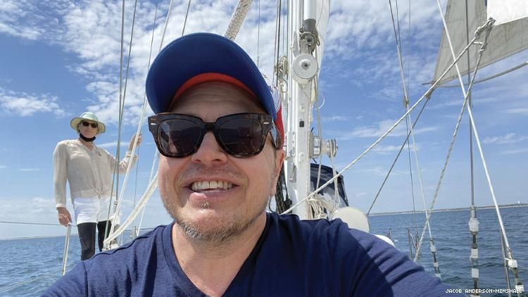 Jacob Anderson-Minshall sailing with Moments Sailing