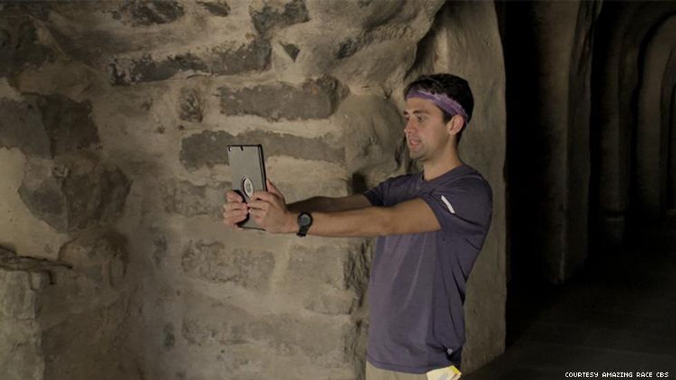 James of 32nd The Amazing Race in a tomb in india