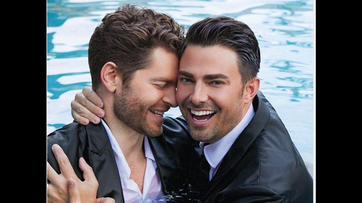 jonathan bennett and jaymes vaughn in a pool in suits hugging