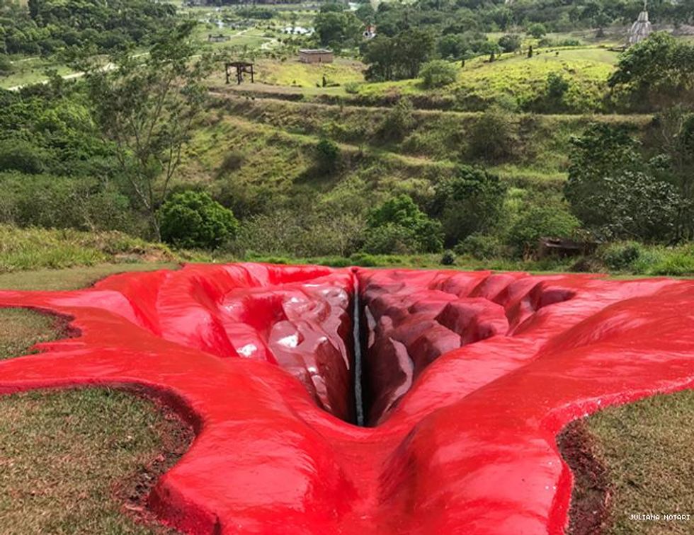 Juliana Notari resin female artwork Diva being dug into hillside in Brazil