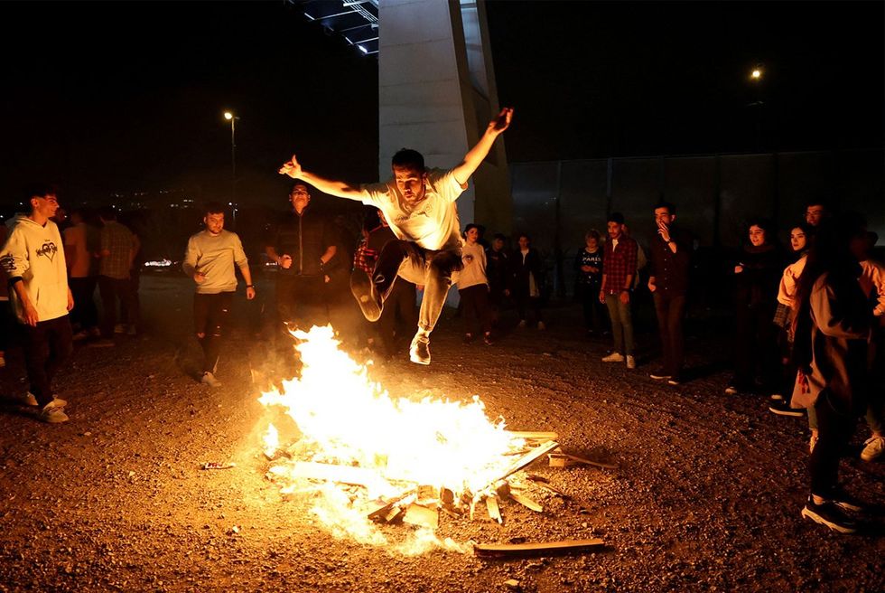 Jumping over a fire at