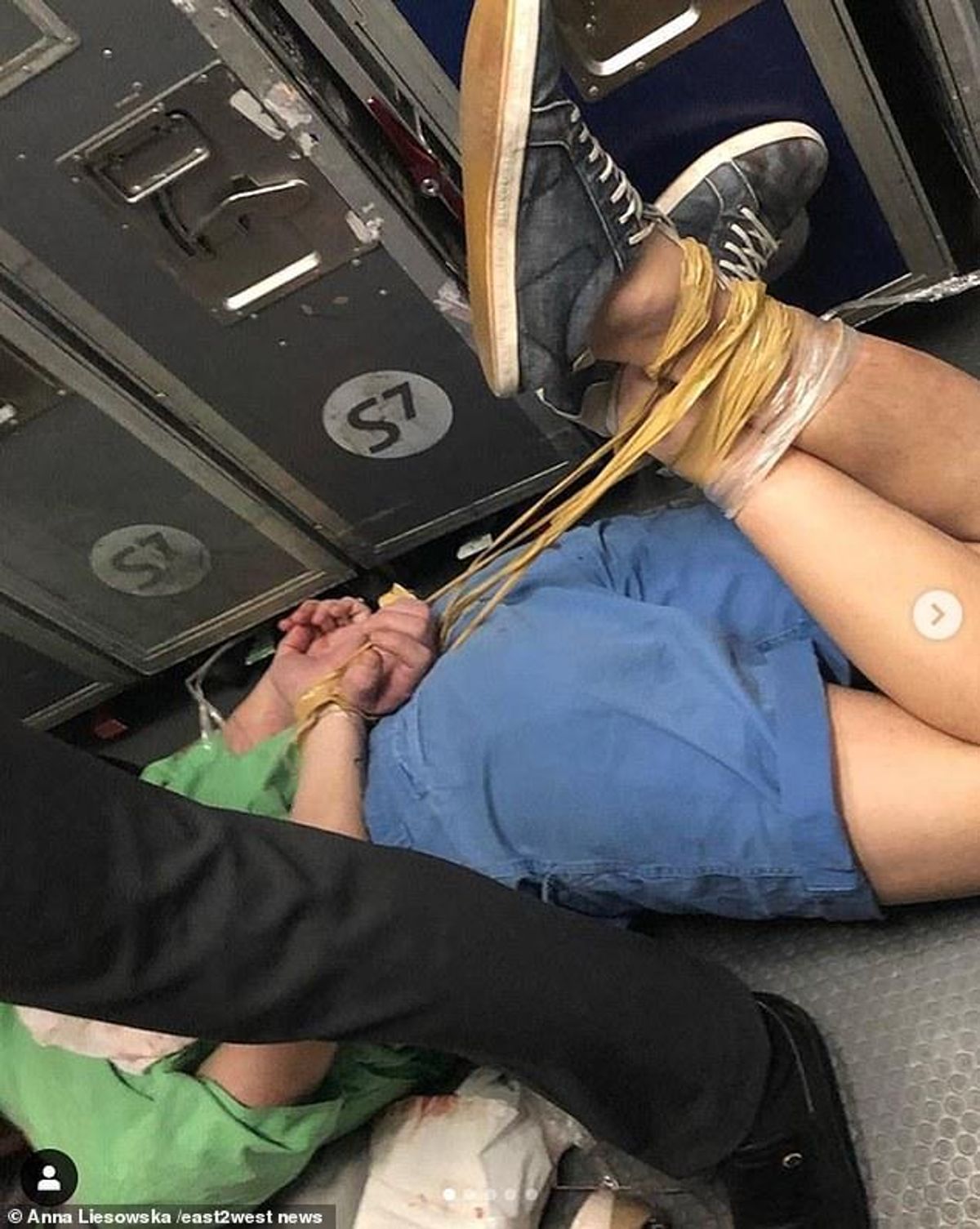 man on plane on the ground drunk
