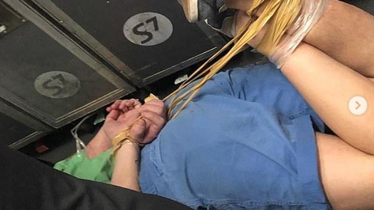 man on plane on the ground drunk