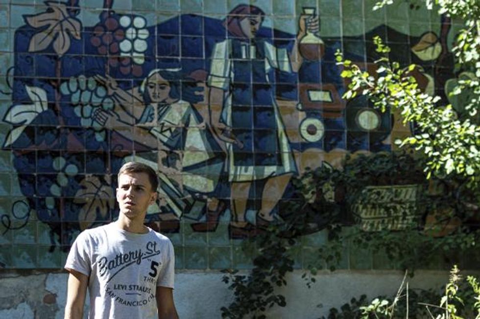 Marko K in front of Ukraine mural