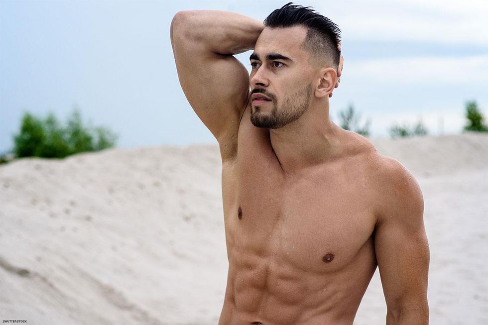 Muscular shirtless man on beach