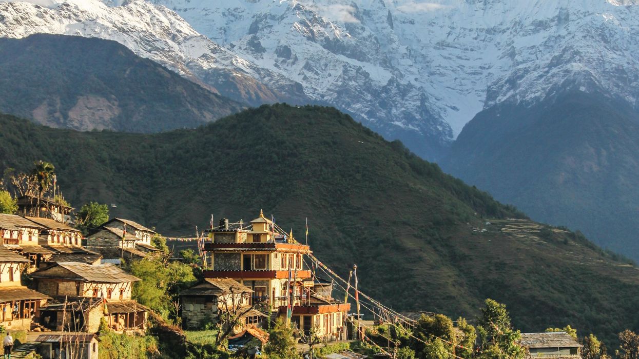 Nepal houses below mountain range
