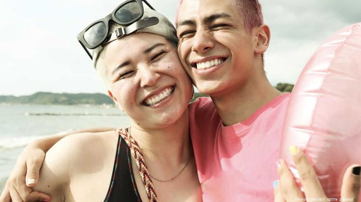 Nonbinary friends on beach