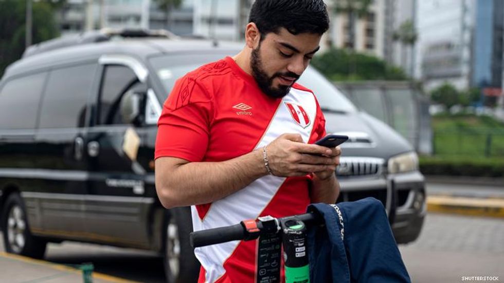 Peru man on smart phone