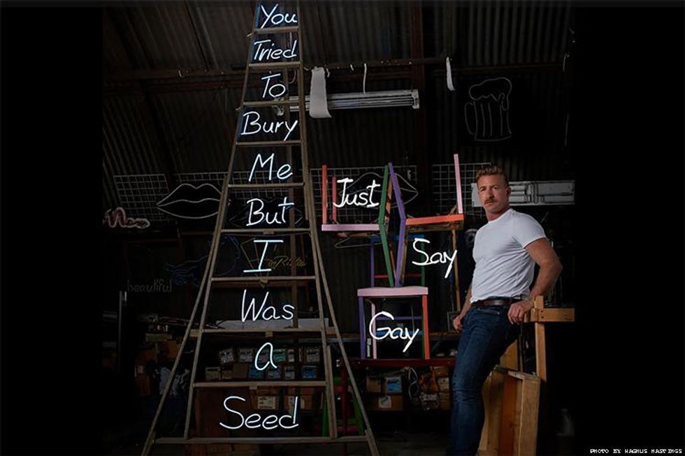 Portrait of the artist shown with \u201cJust Say Gay\u201d (2022), and \u201cTwelve Steps\u201d (2021). Photo by Magnus Hastings (2022)