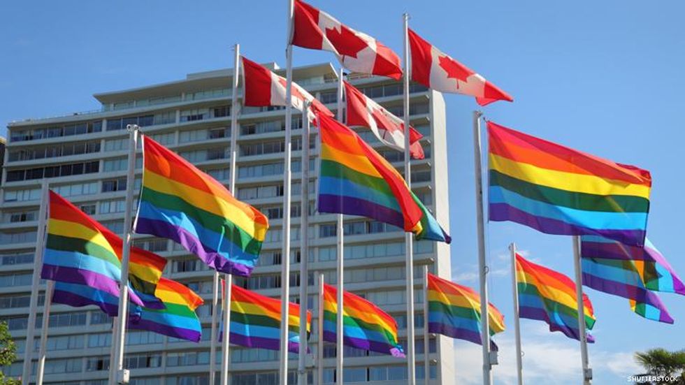 Rainbow flags fly with Canadian flag in Vancouver