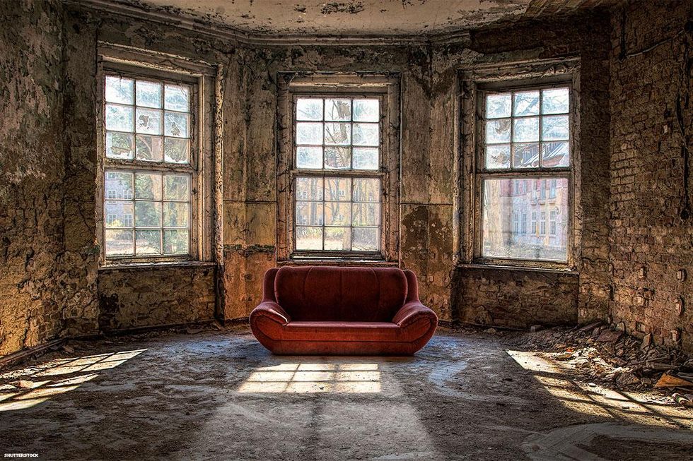 red couch in abandoned building