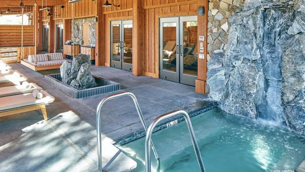 Rush Creek Spa Outdoor Lounge Featuring Granite Waterfall Hot Tub