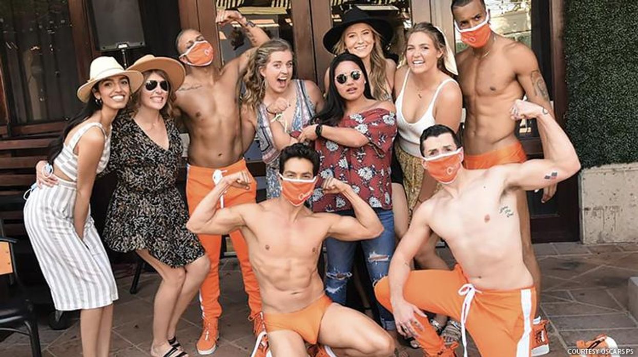 Staff flex, mug, and pose for a picture.