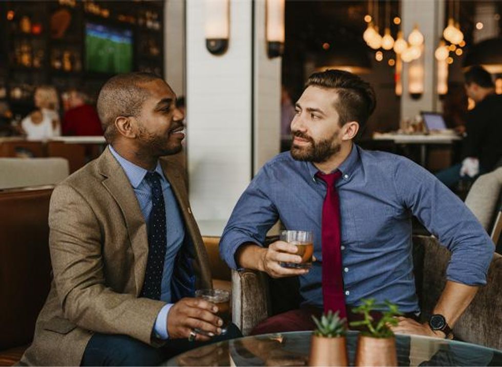 Two men drink Old Fashions at The Porch bar in Louisville Kentucky