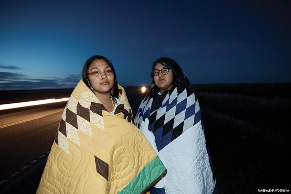 Two unnamed Two-Spirt Lakota friends next to a highway on South Dakota\u2019s Pine Ridge Reservation