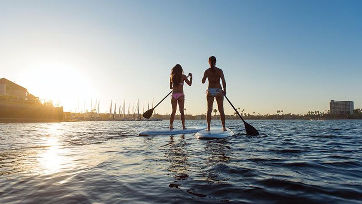 Two women paddleboarding, Mission Bay, San Diego