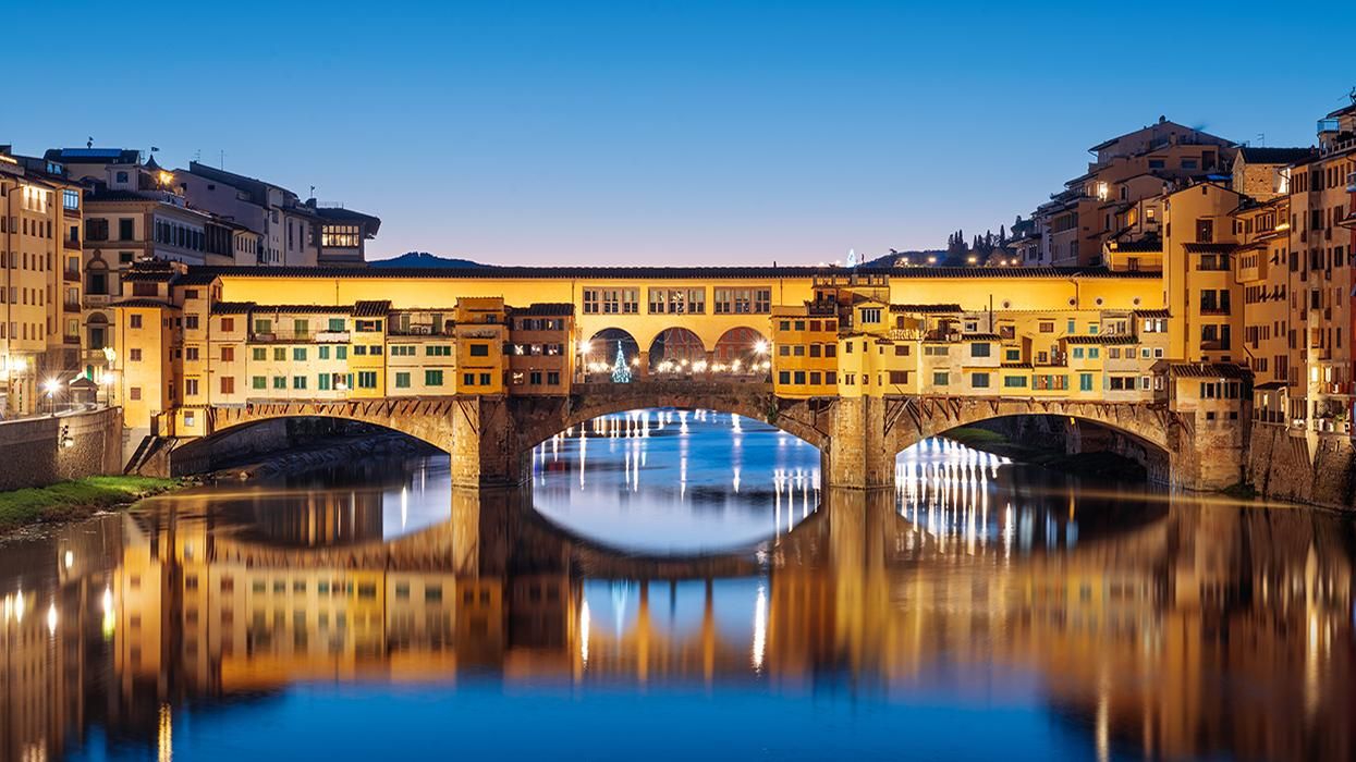 U.S. Tourist Drives Rental Car on Historic Medieval Bridge